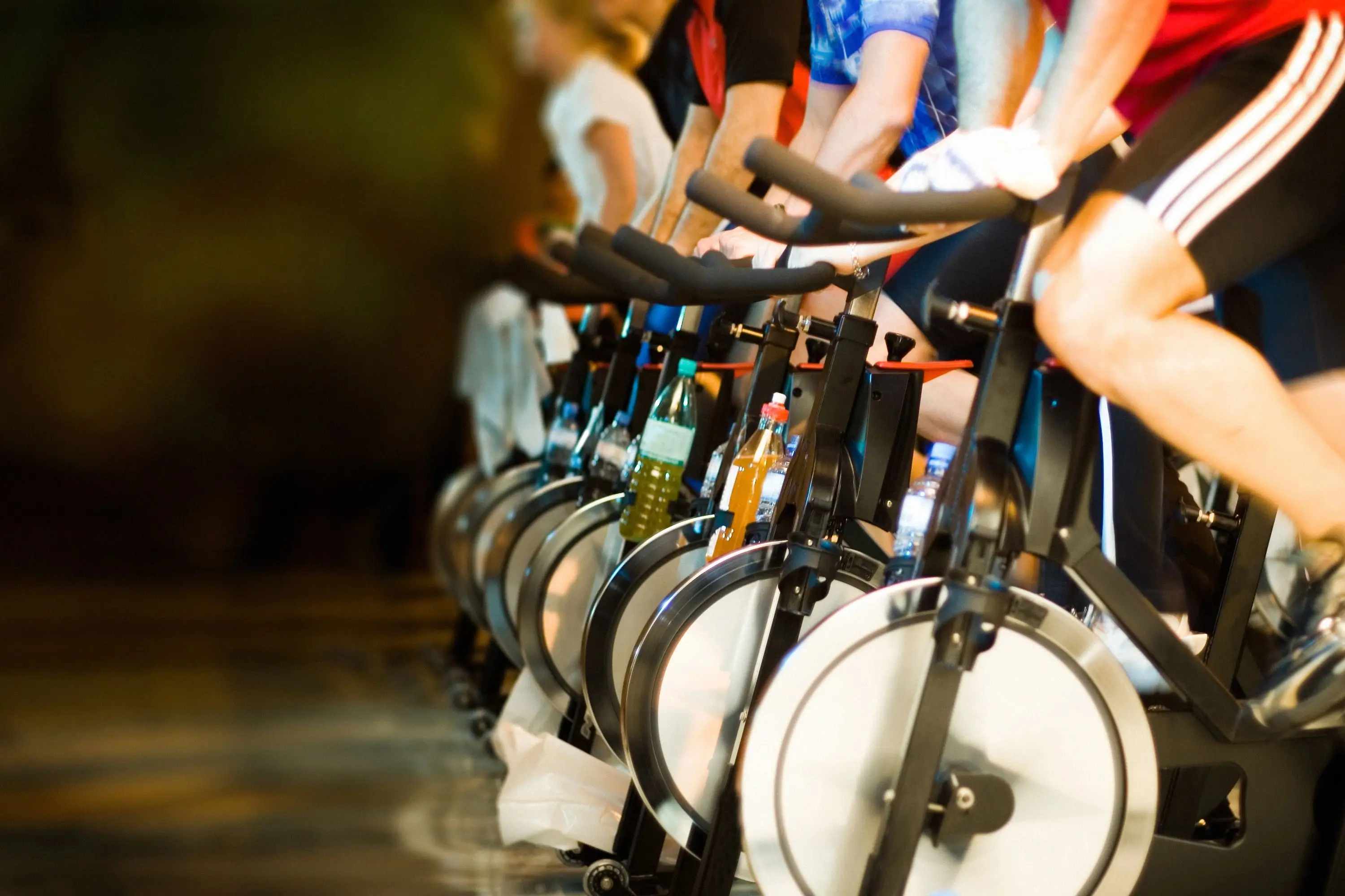 A high-energy spin class with focused cyclists