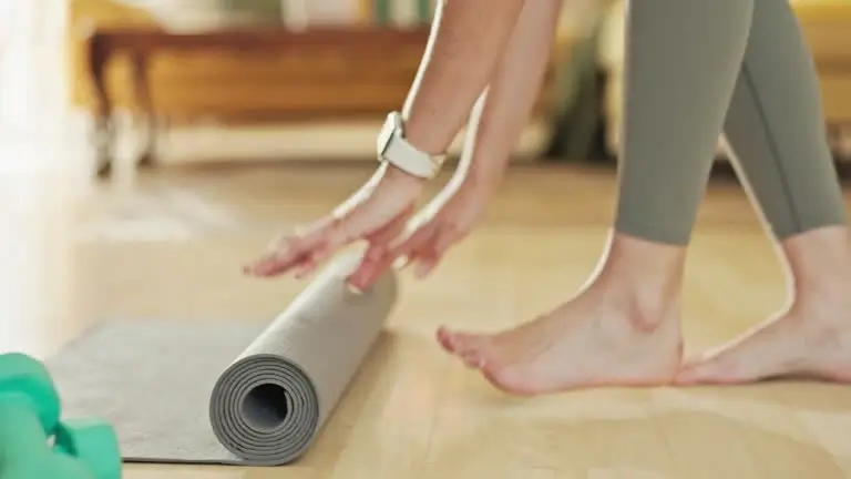 A person stretching on a yoga mat